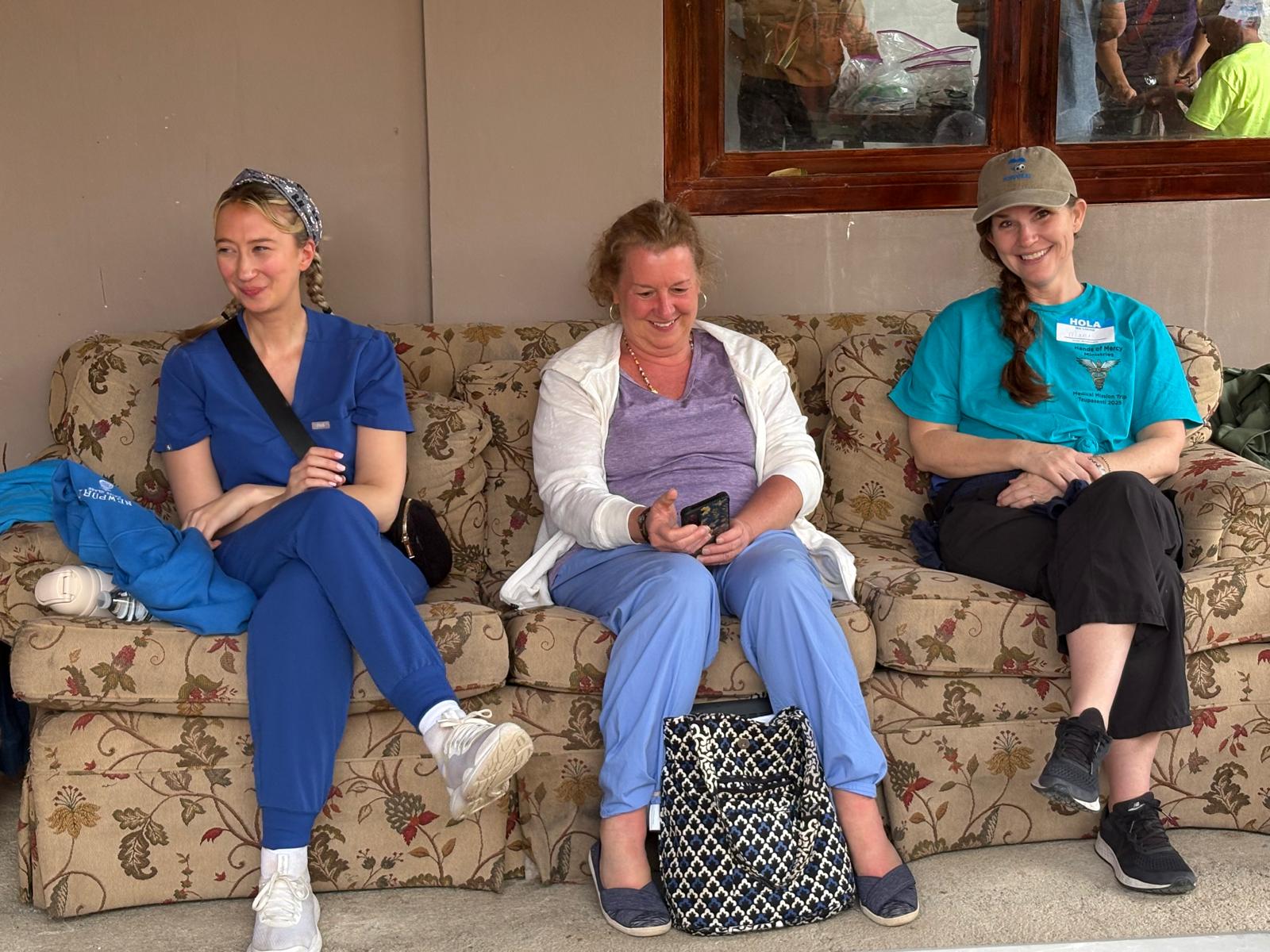 Hands of Mercy volunteers relaxing and smiling together